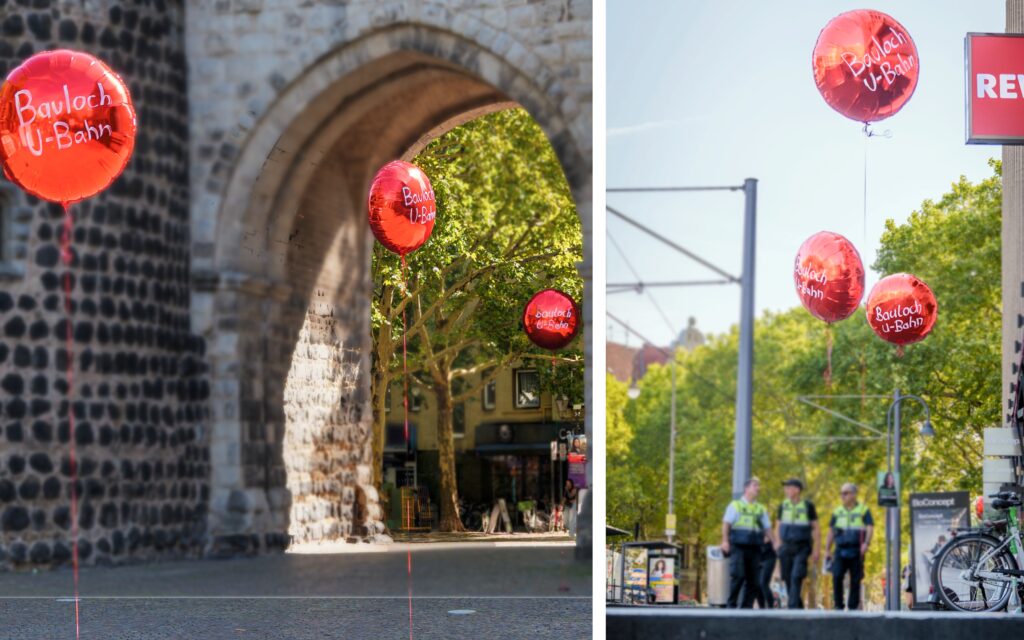 Große rote Ballons schweben an rote Schnüren in Köln vor dem Hahnentor und am Rudolfplatz, ©Lucas Rosenthal